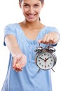 Pills, clock and portrait of a woman in a studio waiting to take medicine, vitamins or supplements. Tablets, health and Royalty Free Stock Photo