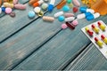 Assortment of pills on wooden background, close-up