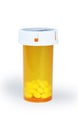 Pills Container with Several White Pills Inside Royalty Free Stock Photo