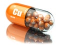 Pills with copper cuprum Cu element. Dietary supplements. Vitamin capsules. Royalty Free Stock Photo