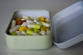 Pills of different color inside a metal box Royalty Free Stock Photo