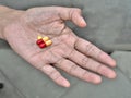 Pills on elder hand