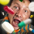 Pills falling into open mouth Royalty Free Stock Photo