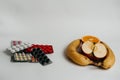 Pills and fruits on a white background Royalty Free Stock Photo