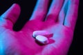 Pills in hand. Two drug tablets in palm close-up Royalty Free Stock Photo