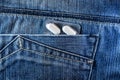 Pills in jeans pocket. Blister pack of white pills in back jeans pocket. Care health concept Royalty Free Stock Photo