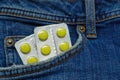 Pills in the Jeans Pocket. Close-Up Of Medicines In Pocket Of Jeans Royalty Free Stock Photo