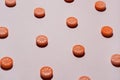 Pills like an orange on a beige background. Vitamin C. Health concept Royalty Free Stock Photo