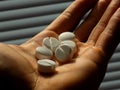 Pills on men hand in psychiatry