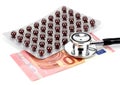 Pills, money and a stethoscope Royalty Free Stock Photo