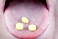 Pills in mouth Royalty Free Stock Photo