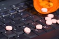 Pills on notebook keyboard