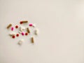 Pills on off-white background, top view with copy space