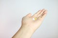 pills in outstretched hand isolated from background Royalty Free Stock Photo