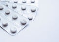 Three plastic packaging pills on a white background