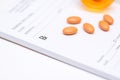 Pills on a prescription pad Royalty Free Stock Photo