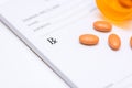 Pills on a prescription pad Royalty Free Stock Photo