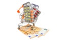 Pills in a shopping cart with money Royalty Free Stock Photo