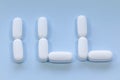 Pills spelling out the word `Ill`