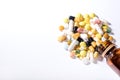 Pills spilled out of pill bottle, top view. Medication and medicine tablets. Copy space Royalty Free Stock Photo