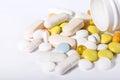 Pills spilled out of pill bottle, top view. Medication and medicine tablets. Copy space Royalty Free Stock Photo