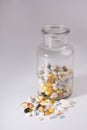 Pills spilled out of pill bottle, top view. Medication and medicine tablets. Copy space Royalty Free Stock Photo