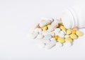 Pills spilled out of pill bottle, top view. Medication and medicine tablets. Copy space Royalty Free Stock Photo