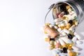 Pills spilled out of small bucket, top view. Medication and medicine tablets. Copy space Royalty Free Stock Photo
