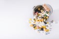 Pills spilled out of small bucket, top view. Medication and medicine tablets. Copy space Royalty Free Stock Photo