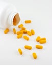 Pills spilling from bottle Royalty Free Stock Photo