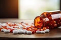 Pills spilling out of pill bottle on wooden table. Focus on foreground, Prescription opioids open bottle with many bottles of Royalty Free Stock Photo