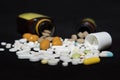 Pills spilling out of pill bottles Royalty Free Stock Photo