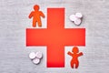 Pills, stickmen and red cross. Royalty Free Stock Photo