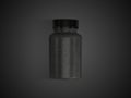 Pills or supplement capsules clear black bottles top view