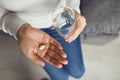 Pills tablet in hand of the girl in the room. Concept virus cold pill sick flu sickness headache flu illness Royalty Free Stock Photo