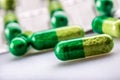 Pills. Tablets. Capsule. Heap of pills. Medical background. Close-up of pile of yellow green tablets Royalty Free Stock Photo