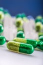 Pills. Tablets. Capsule. Heap of pills. Medical background. Close-up of pile of yellow green tablets Royalty Free Stock Photo