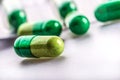 Pills. Tablets. Capsule. Heap of pills. Medical background. Close-up of pile of yellow green tablets Royalty Free Stock Photo