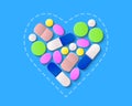 Pills, tablets and capsules inside a heart shape Royalty Free Stock Photo