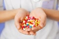 Pills, tablets and drugs heap in doctor's hand Royalty Free Stock Photo