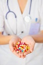 Pills, tablets and drugs heap in doctor's hand