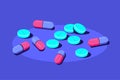 Pills and tablets of medical drugs on blue background.