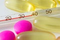 Pills and thermometer Royalty Free Stock Photo