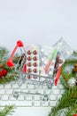 Christmas shopping cart with medicines on the computer