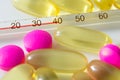 Pills and thermometer Royalty Free Stock Photo