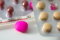 Pills and thermometer Royalty Free Stock Photo