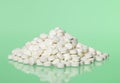 Pills toward green background Royalty Free Stock Photo