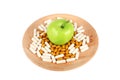 Pills on wooden plate and an apple isolated on white Royalty Free Stock Photo