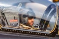 Pilot from the Al Fursan Aerobatic team of the United Arab Emirates Air Force in the cockpit of Aermacchi MB-339 jet training airc Royalty Free Stock Photo