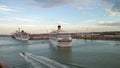 Civitavecchia, Italy - Oct 05, 2018: Pilot boat and cruise liners in port water area